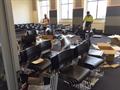 Set up of 300 student tablet arm chairs for temporary classrooms