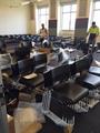 Set up of 300 student tablet arm chairs for temporary classrooms
