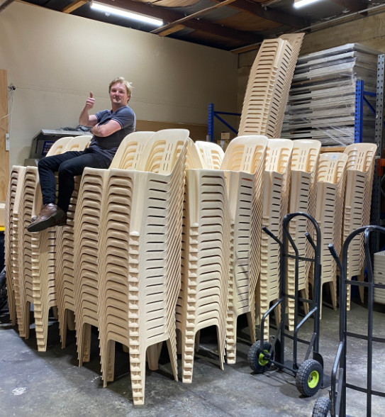 Hundreds of high backed white plastic chairs for hire & rental in Melbourne